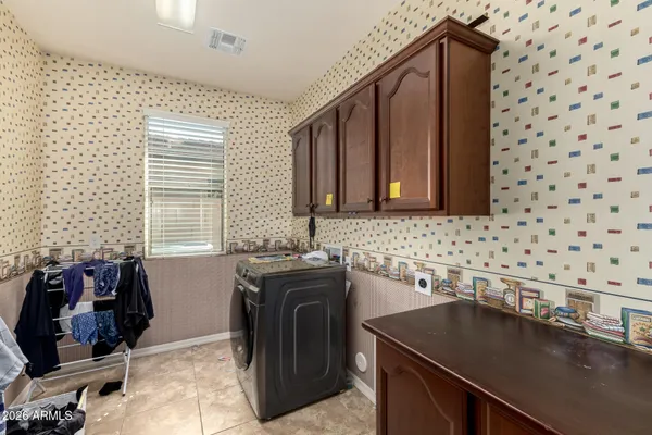 a kitchen with granite countertop a sink and a stove top oven
