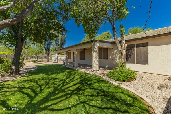 a view of a back yard of the house