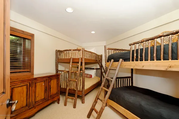 a bed room with a bed and furniture