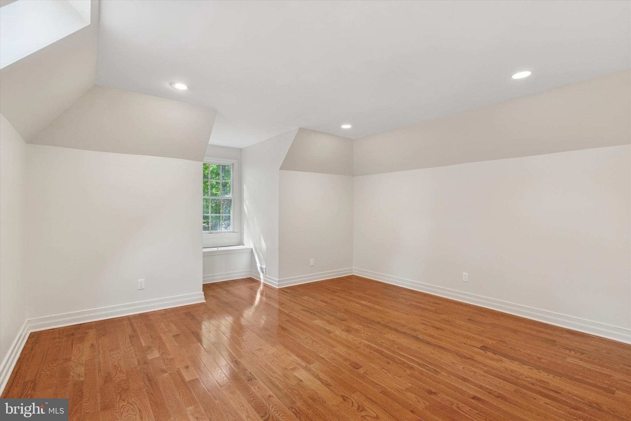 2824 Hill Road Green Lane, PA 18054 - Photo 22 of 40 an empty room with wooden floor and windows