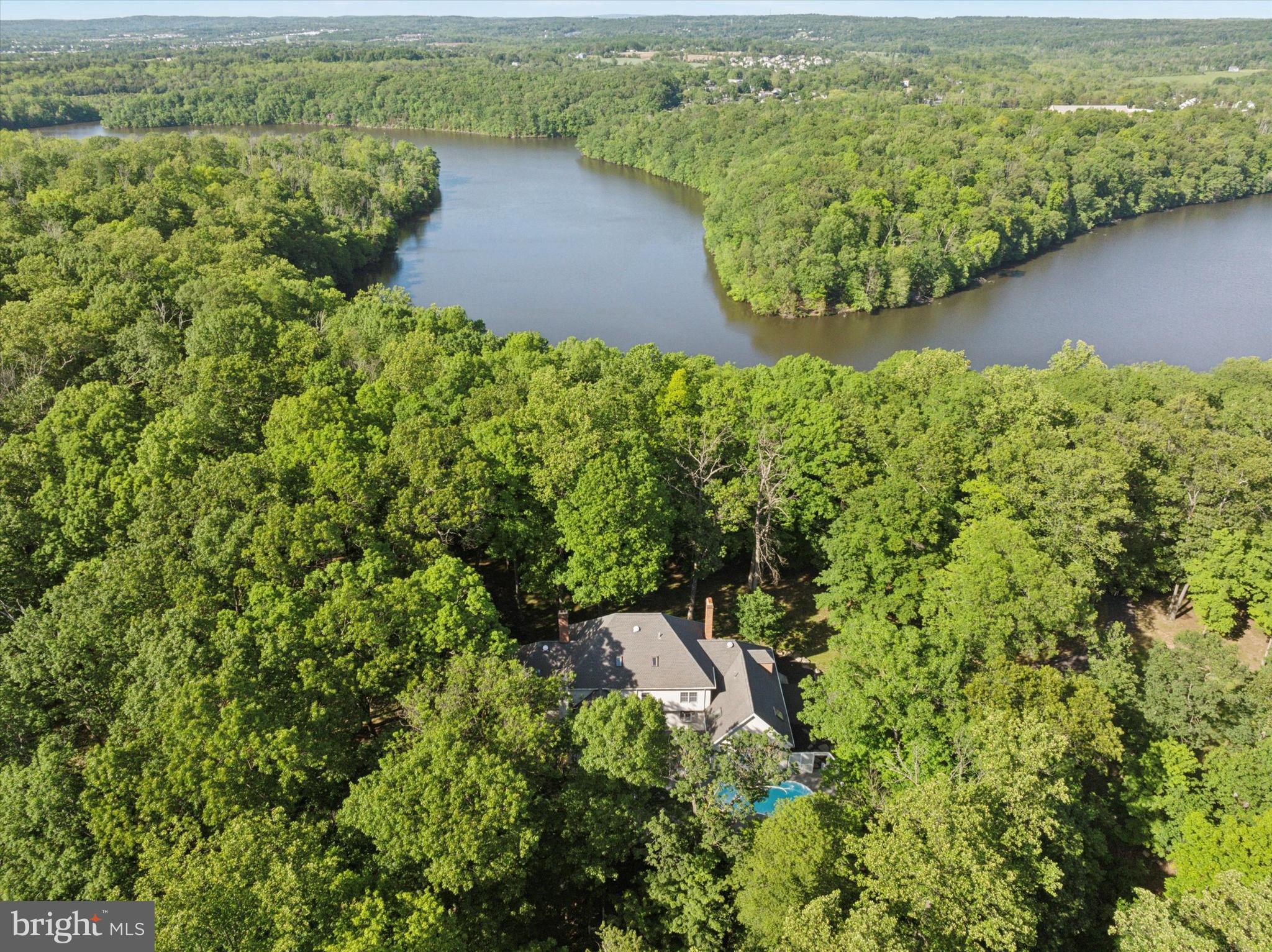 2824 Hill Road Green Lane, PA 18054 - Photo 34 of 40 an aerial view of a house with a yard and lake view