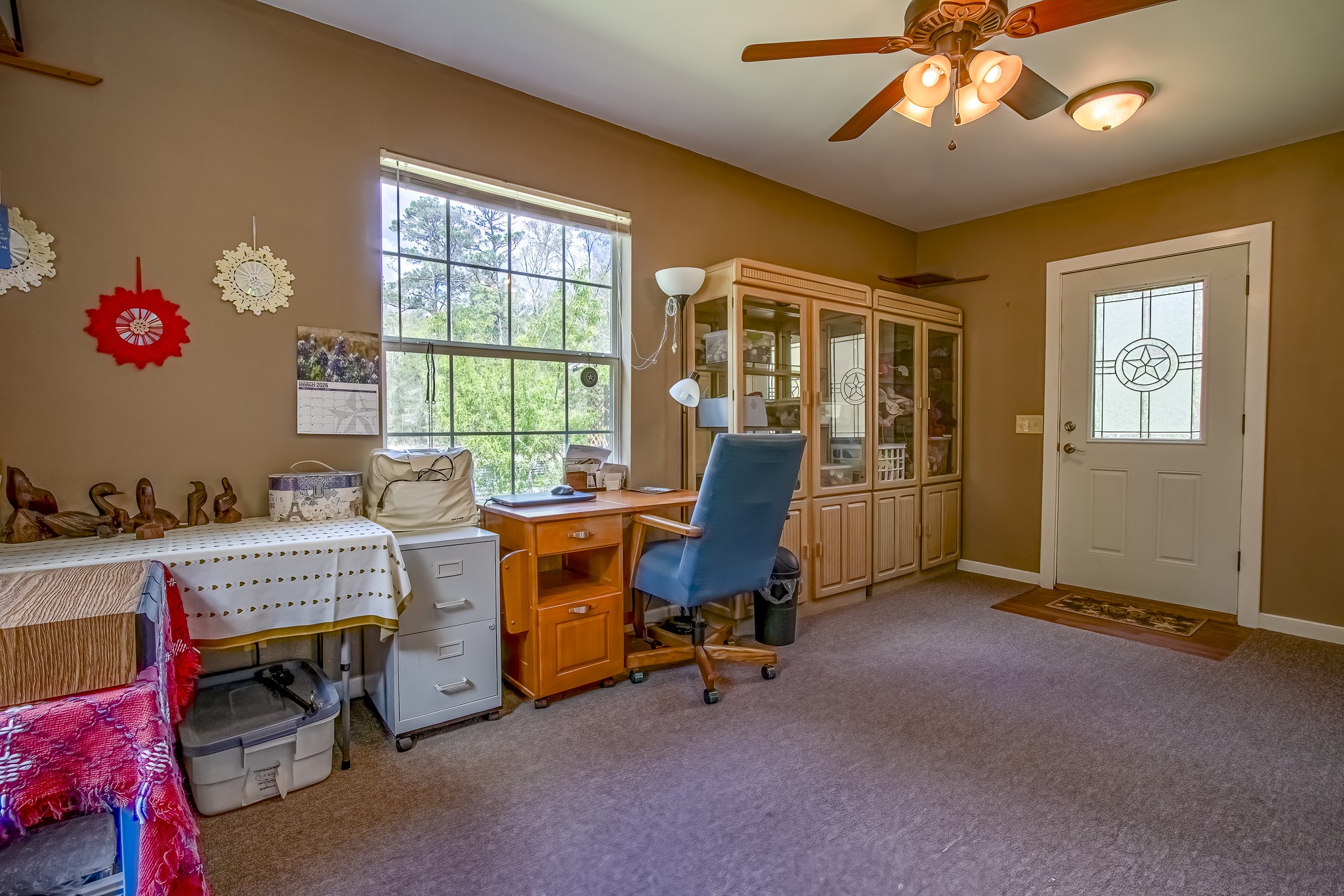 188 Pullin Road Corrigan, TX 75939 - Photo 13 of 50 a view of a workspace with furniture and a window