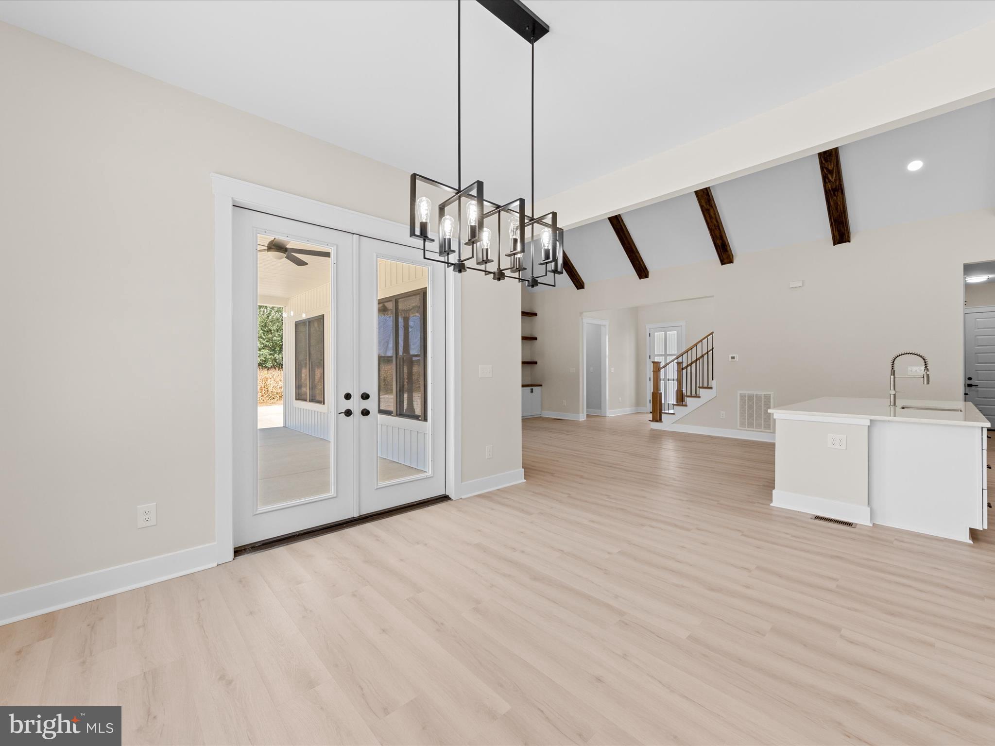 37000 Brittingham Road Delmar, DE 19940 - Photo 27 of 74 a view of a room with wooden floor and a ceiling fan