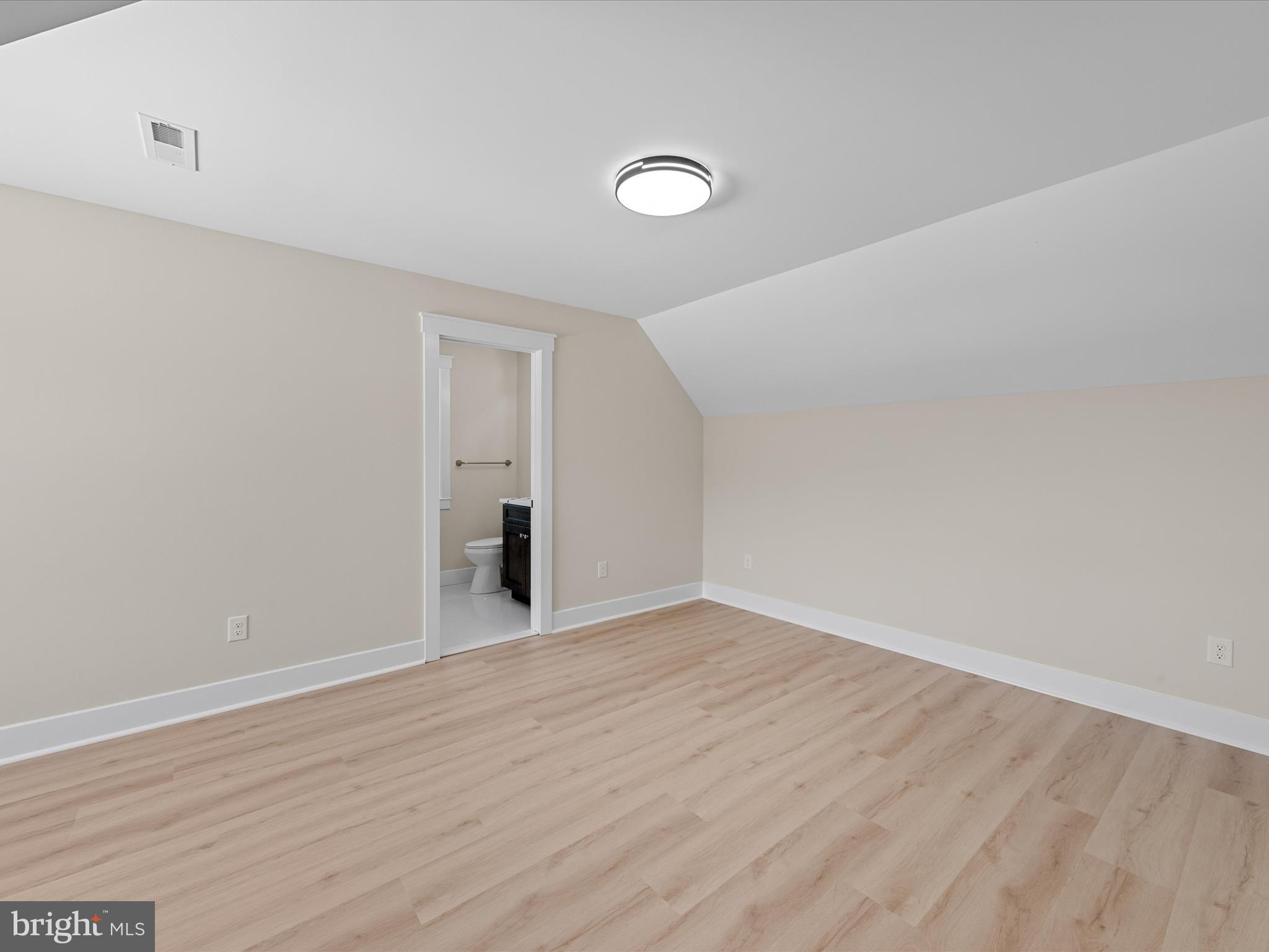 37000 Brittingham Road Delmar, DE 19940 - Photo 58 of 74 a view of an empty room with wooden floor and entryway