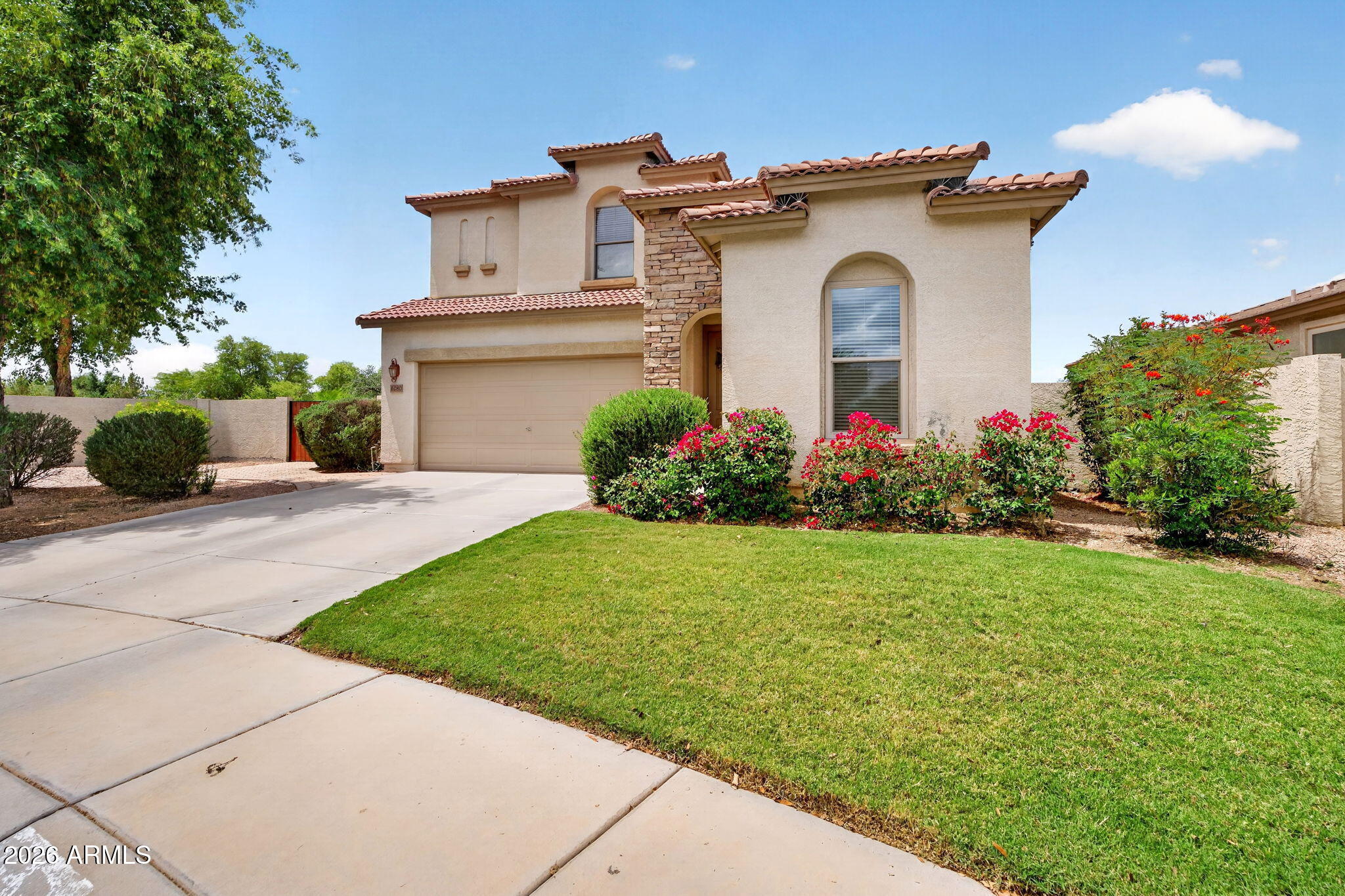 6280 South Sinova Court Gilbert, AZ 85298 - Photo 3 of 64 a front view of a house with a yard