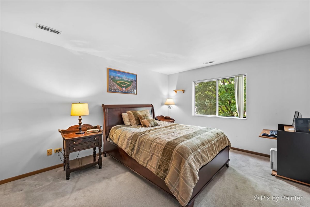 47 Orchard Terrace, Unit 8 Lombard, IL 60148 - Photo 11 of 16 a bedroom with a bed and a window