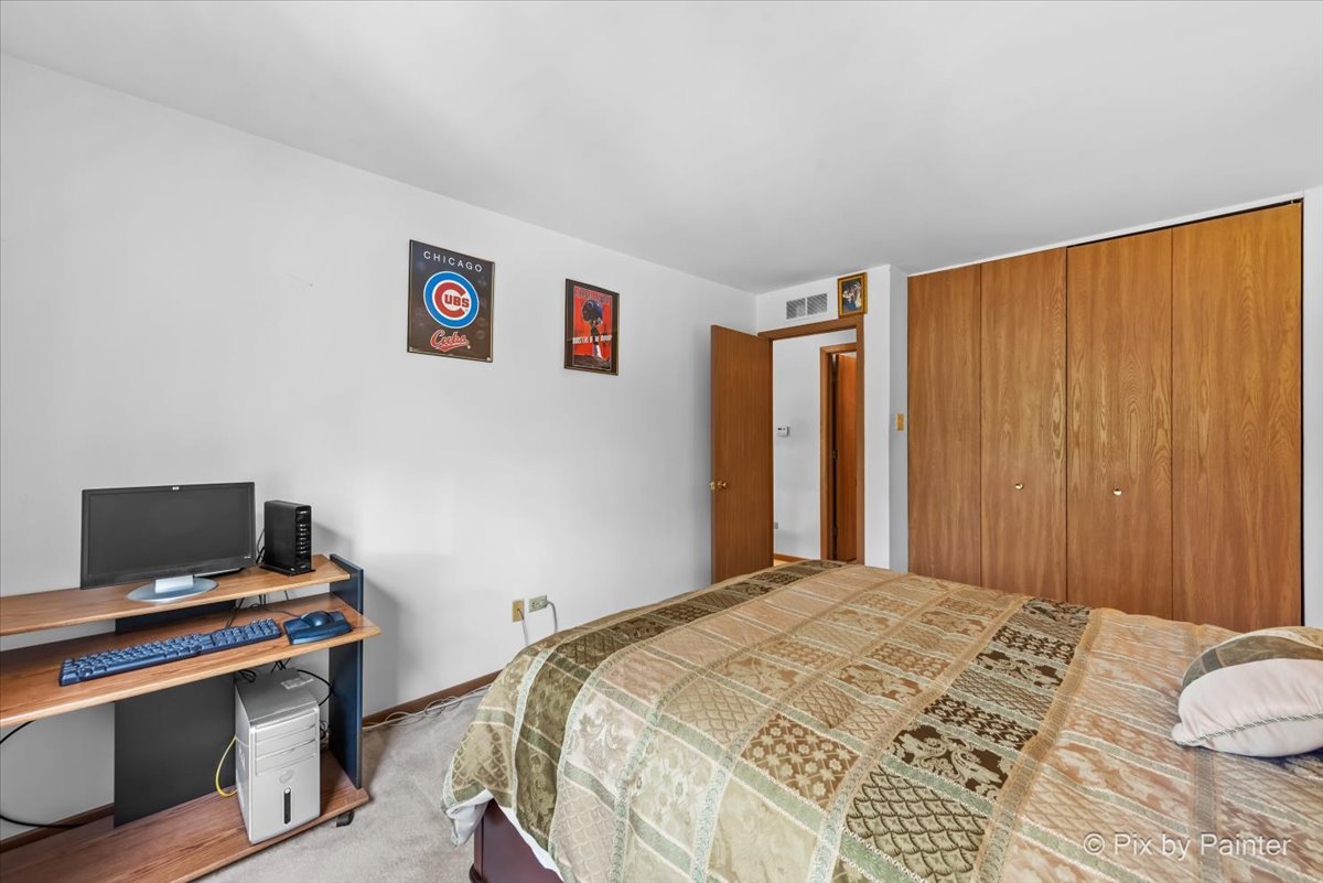47 Orchard Terrace, Unit 8 Lombard, IL 60148 - Photo 12 of 16 a bedroom with a bed and a window