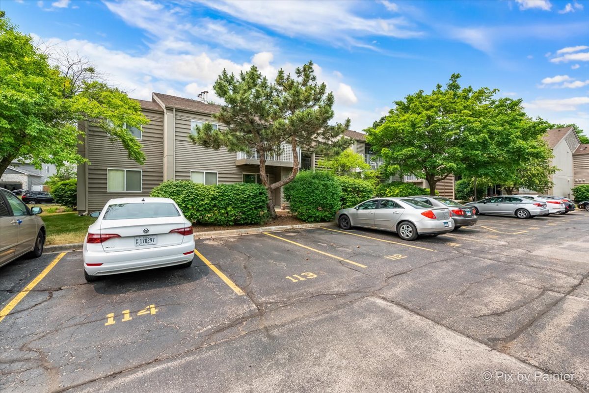 47 Orchard Terrace, Unit 8 Lombard, IL 60148 - Photo 15 of 16 a white car parked in front of a house