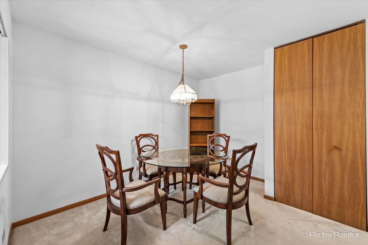 47 Orchard Terrace, Unit 8 Lombard, IL 60148 - Photo 5 of 16 a dining room with furniture and window