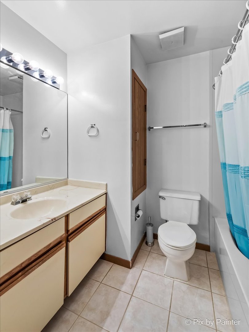 47 Orchard Terrace, Unit 8 Lombard, IL 60148 - Photo 10 of 16 a bathroom with a sink toilet and shower