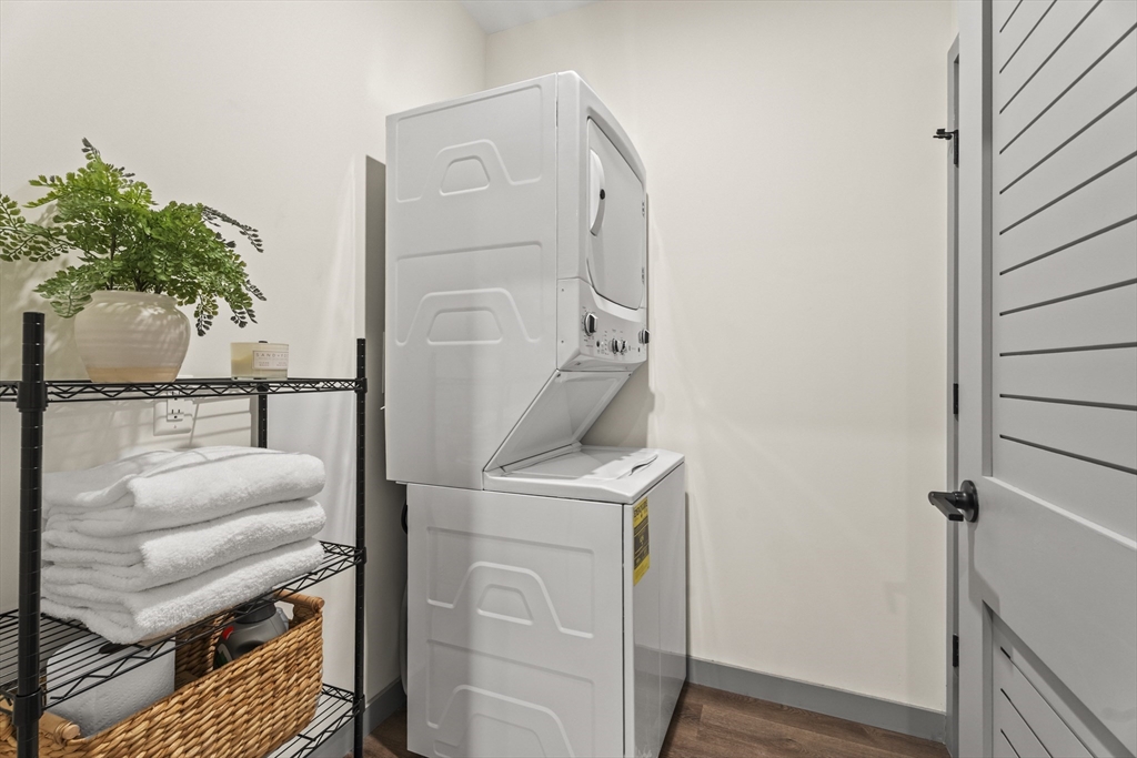 203 Lowell Street, Unit 103 Wilmington, MA 01887 - Photo 13 of 39 a view of hallway with washer and dryer