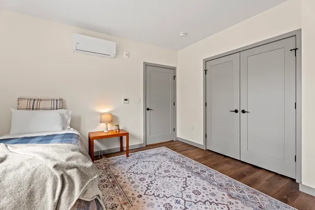 a bedroom with a bed and a table in it