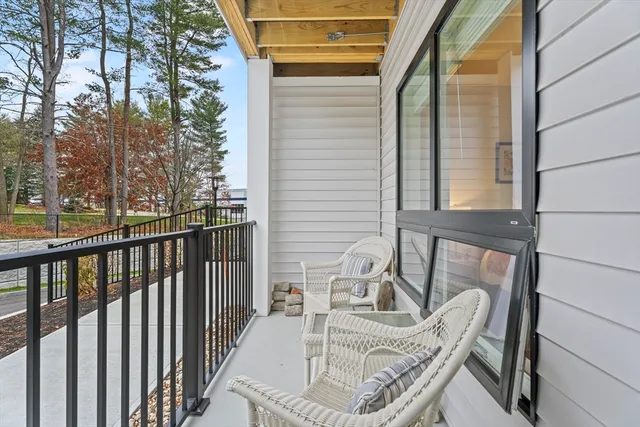 a view of balcony with furniture