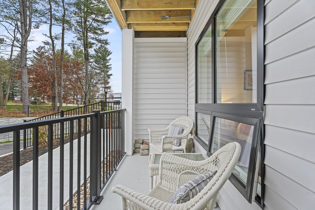 203 Lowell Street, Unit 103 Wilmington, MA 01887 - Photo 17 of 39 a view of balcony with furniture