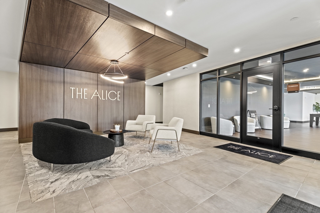 203 Lowell Street, Unit 103 Wilmington, MA 01887 - Photo 20 of 39 a living room with furniture