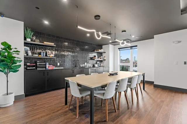 a kitchen with a table and chairs in it