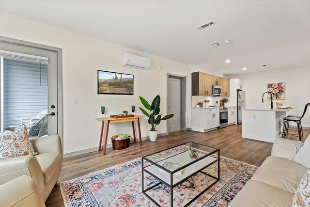 a living room with furniture and a table