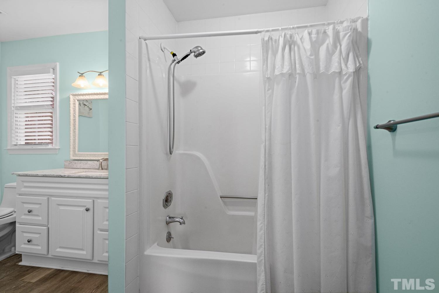 2109 Howson Road Raleigh, NC 27603 - Photo 24 of 36 a bathroom with a shower curtain and a sink