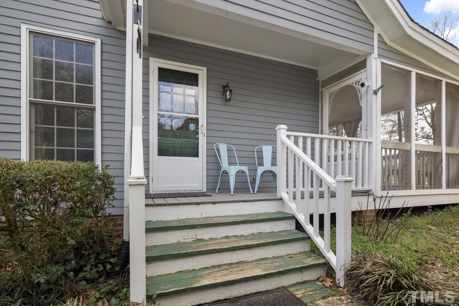 2109 Howson Road Raleigh, NC 27603 - Photo 3 of 36 a view of a house with a small yard and wooden floor and fence and a potted plant