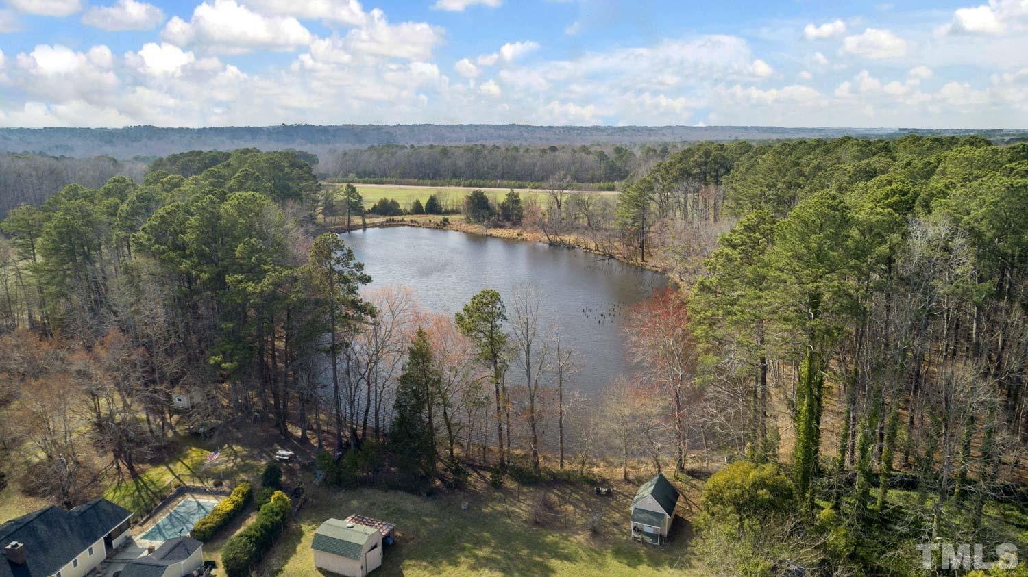 2109 Howson Road Raleigh, NC 27603 - Photo 35 of 36 a view of a lake with a yard