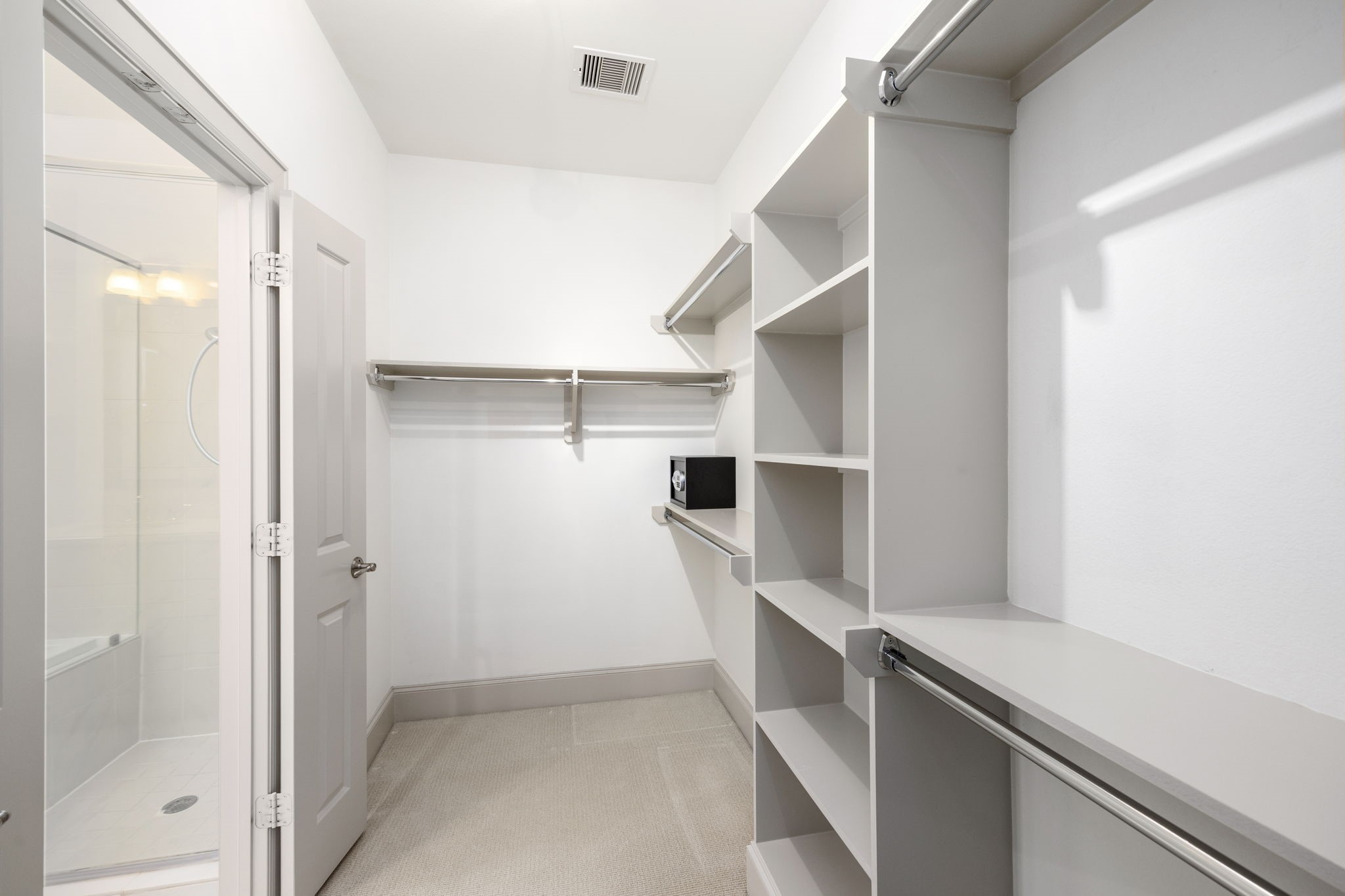 3302 Audley Street, Unit 125 Houston, TX 77098 - Photo 19 of 23 a view of walk in closet with empty racks
