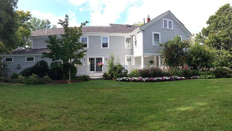 36 Rendezvous Lane Barnstable, MA 02630 - Photo 7 of 23 a front view of a house with a garden