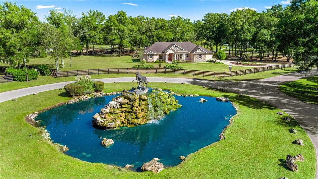 a view of a lake with a house in the background