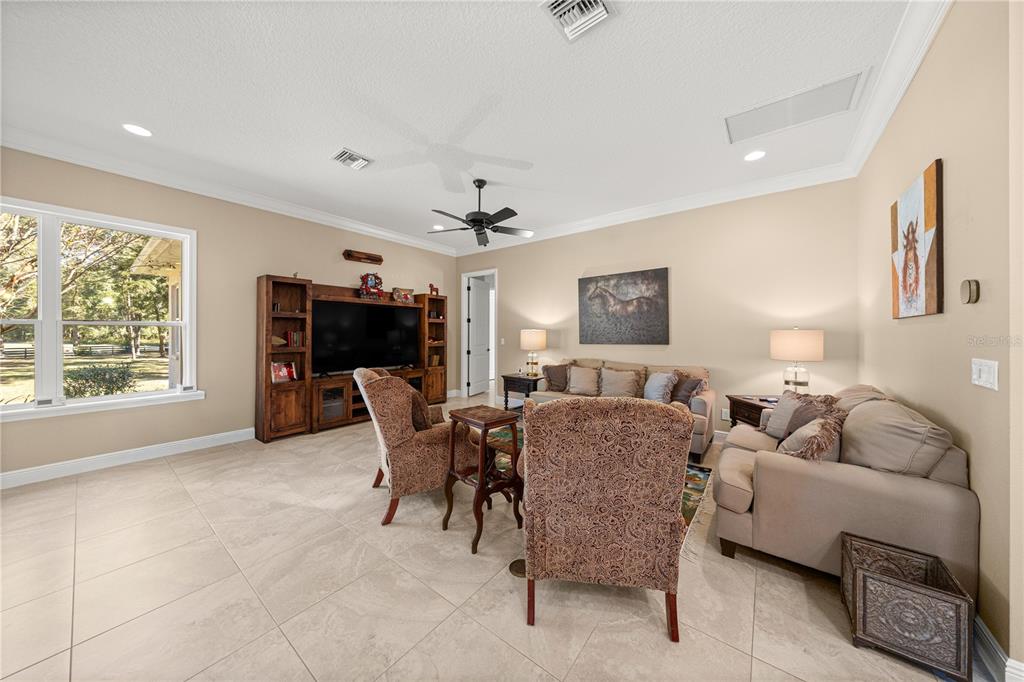 4681 Northwest 101st St Road Ocala, FL 34482 - Photo 11 of 33 a living room with furniture and a fireplace
