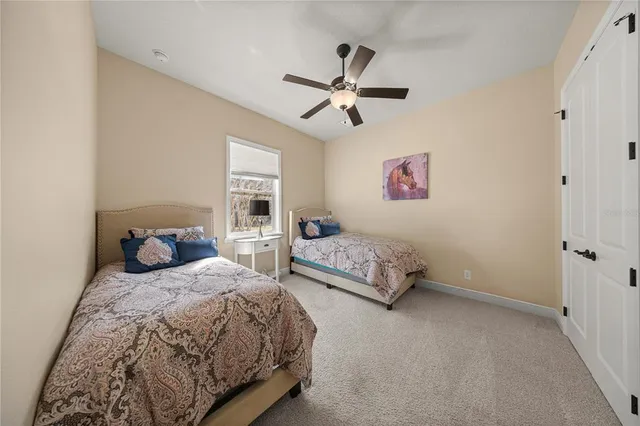 a spacious bathroom with a granite countertop sink a toilet and a mirror