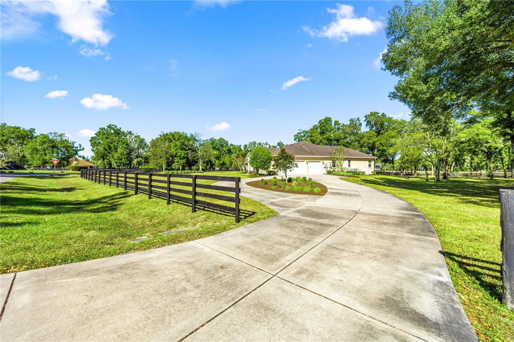 4681 Northwest 101st St Road Ocala, FL 34482 - Photo 31 of 33 a view of a swimming pool and a yard