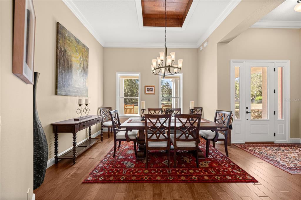 4681 Northwest 101st St Road Ocala, FL 34482 - Photo 7 of 33 a view of a dining room with furniture window and wooden floor