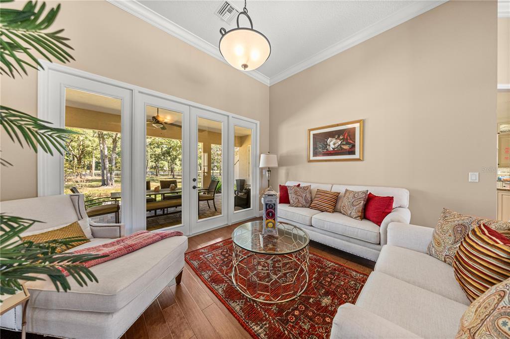 4681 Northwest 101st St Road Ocala, FL 34482 - Photo 10 of 33 a living room with furniture and a large window