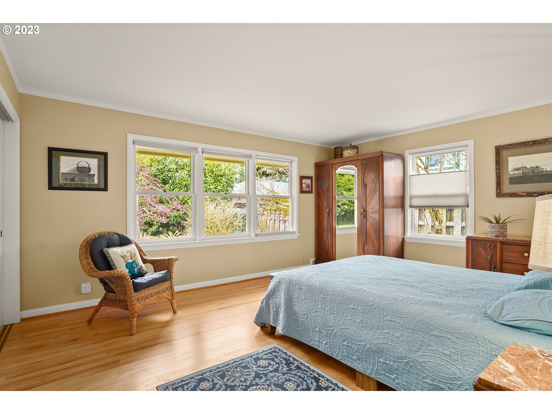 13030 Southwest Fischer Road Tigard, OR 97224 - Photo 14 of 27 a bedroom with a bed and a chair