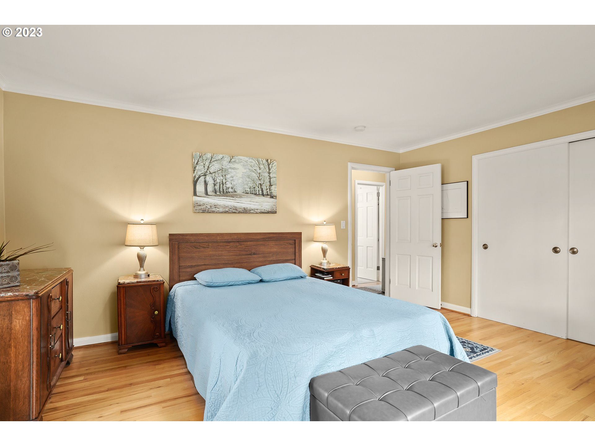 13030 Southwest Fischer Road Tigard, OR 97224 - Photo 15 of 27 a bedroom with a bed and a painting on the wall
