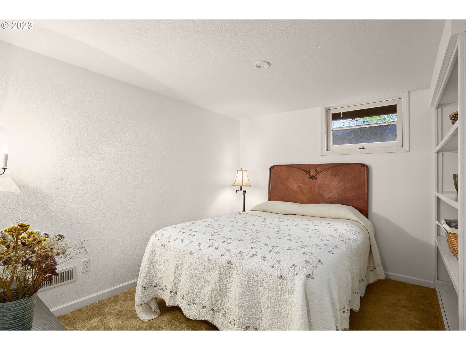 13030 Southwest Fischer Road Tigard, OR 97224 - Photo 18 of 27 a bedroom with a bed and a painting on the wall