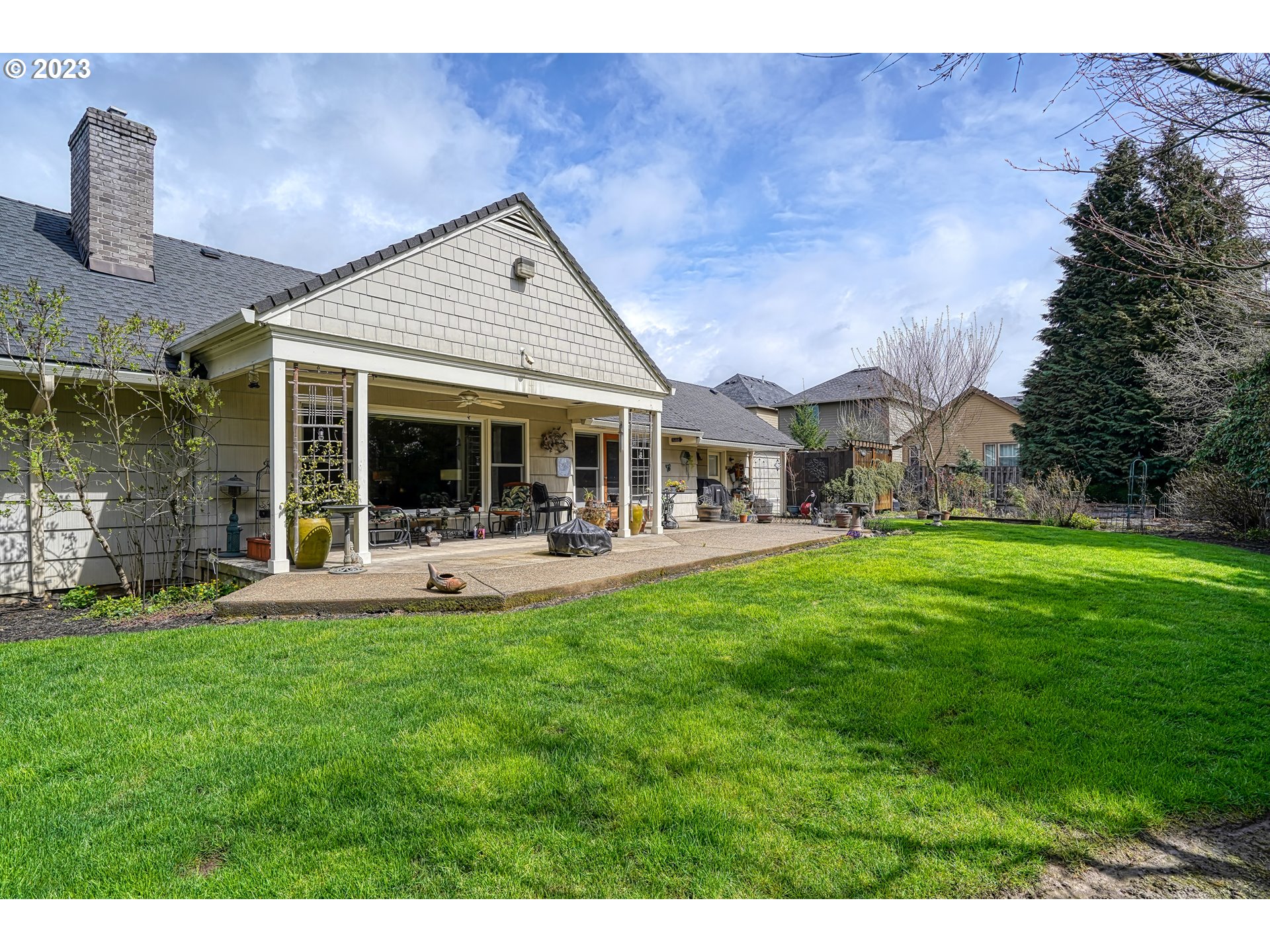 13030 Southwest Fischer Road Tigard, OR 97224 - Photo 24 of 27 a view of a house with a yard porch and sitting area