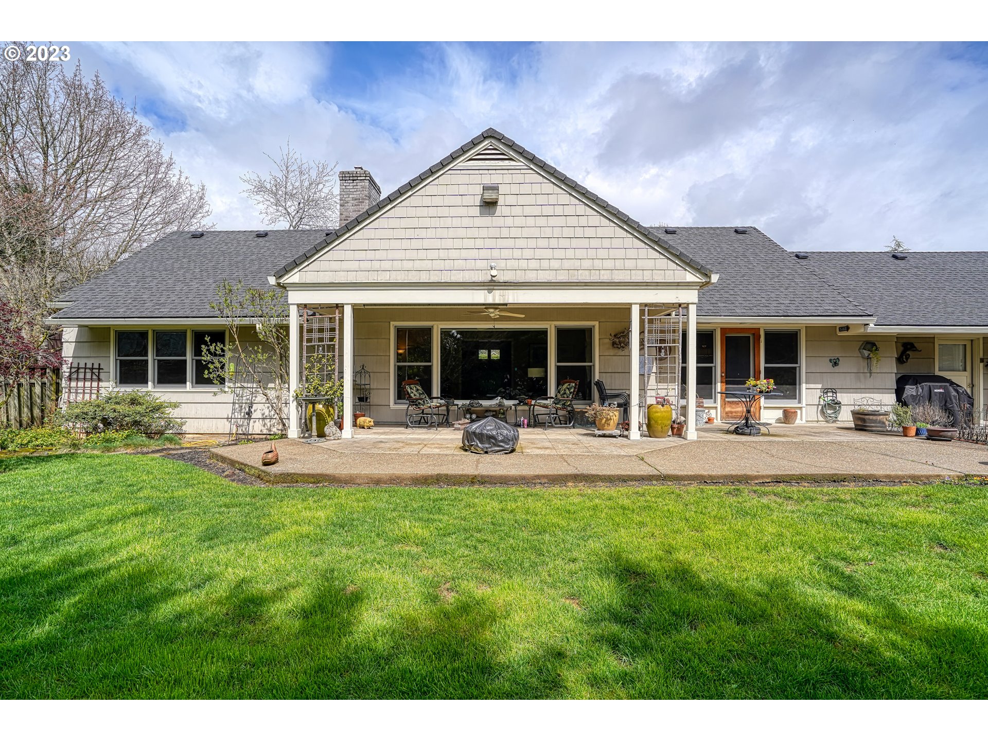 13030 Southwest Fischer Road Tigard, OR 97224 - Photo 25 of 27 a front view of a house with swimming pool and porch with furniture