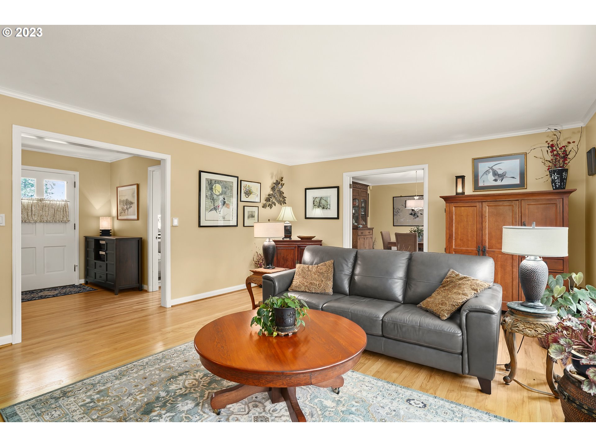 13030 Southwest Fischer Road Tigard, OR 97224 - Photo 5 of 27 a living room with furniture and a dining table