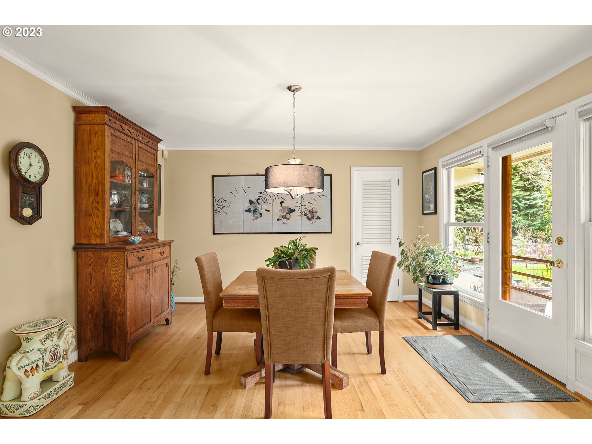 13030 Southwest Fischer Road Tigard, OR 97224 - Photo 7 of 27 a dining room with furniture a chandelier and wooden floor