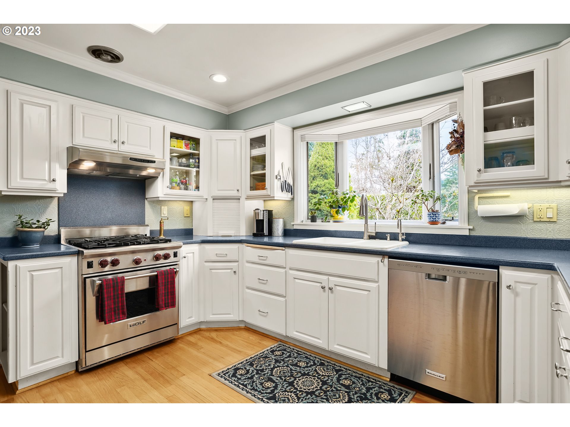 13030 Southwest Fischer Road Tigard, OR 97224 - Photo 9 of 27 a kitchen with stainless steel appliances granite countertop a stove a sink and a microwave