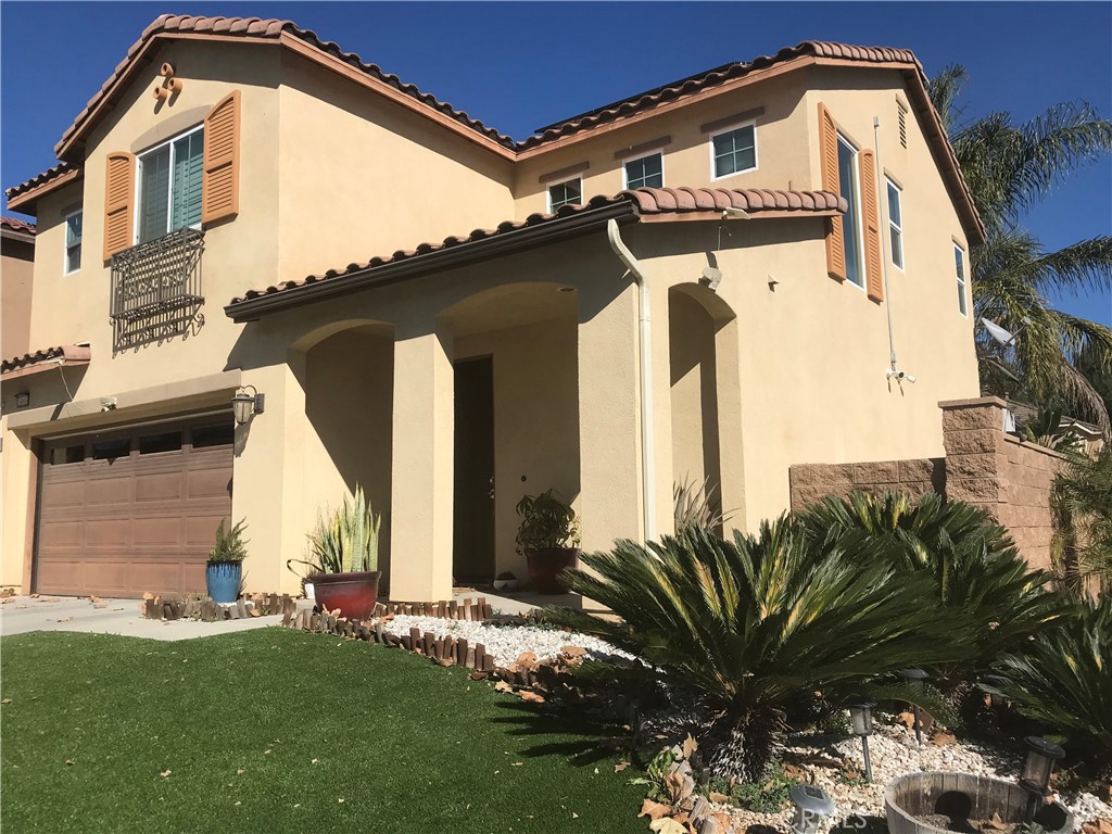 3103 Eastman Court Riverside, CA 92503 - Photo 2 of 4 a view of a house with a small yard
