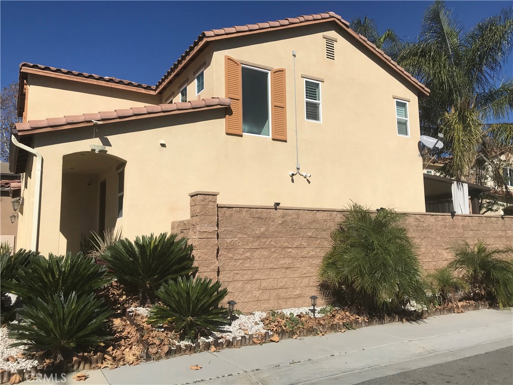 3103 Eastman Court Riverside, CA 92503 - Photo 3 of 4 a front view of a house with a yard