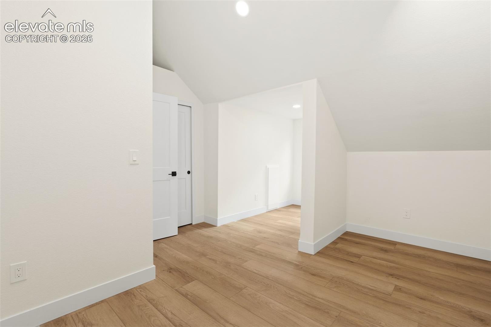 11665 Greentree Road Colorado Springs, CO 80908 - Photo 27 of 43 Bonus room with vaulted ceiling, recessed lighting, and light wood-type flooring