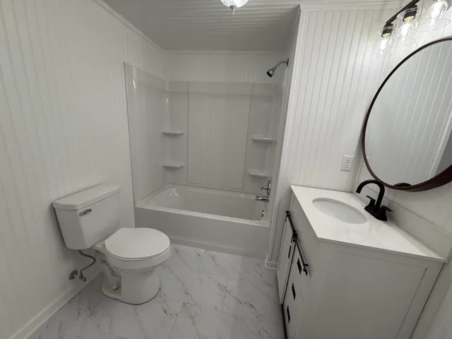 a bathroom with a sink toilet and a bathtub