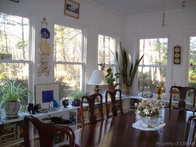 2118 Glebe Road Mathews, VA 23109 - Photo 12 of 22 a view of a dining room with furniture window and outside view