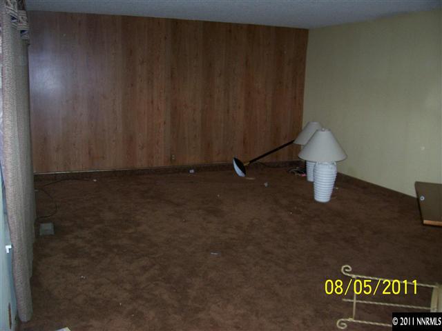 2827 Jake Street Reno, NV 89502 - Photo 5 of 13 an empty room with a wooden door