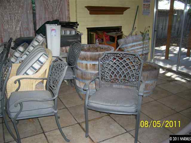 2827 Jake Street Reno, NV 89502 - Photo 6 of 13 a living room with furniture a fireplace and a table