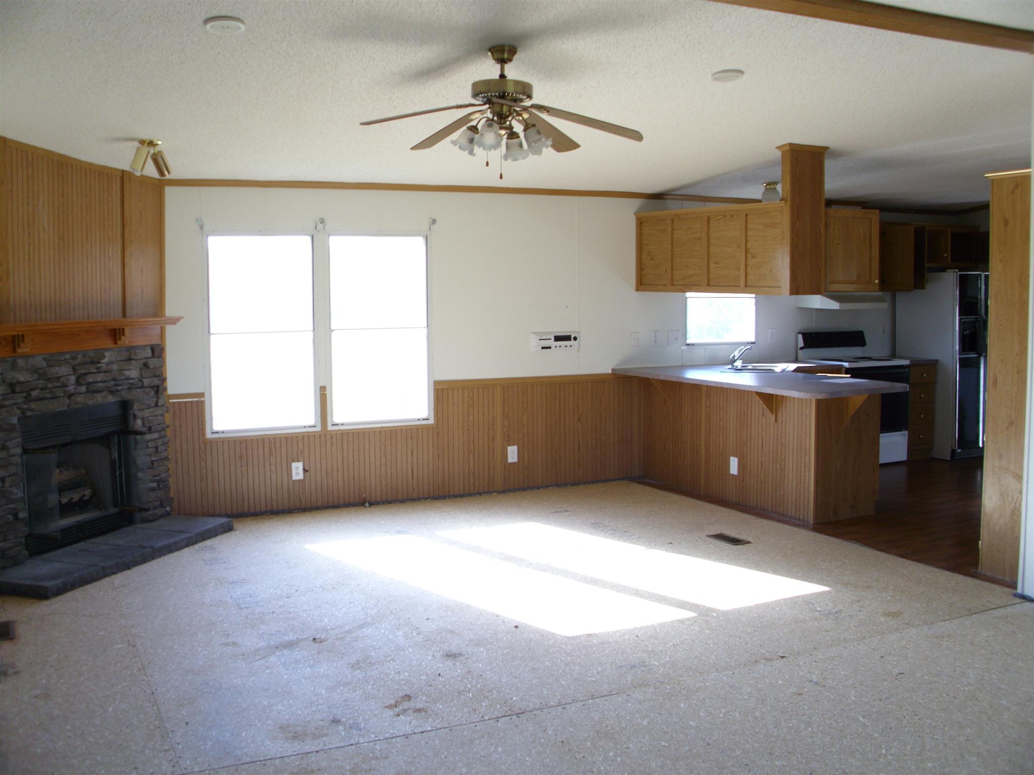 3763 Hoods Branch Road Springfield, TN 37172 - Photo 3 of 15 a kitchen with cabinets a sink and a stove