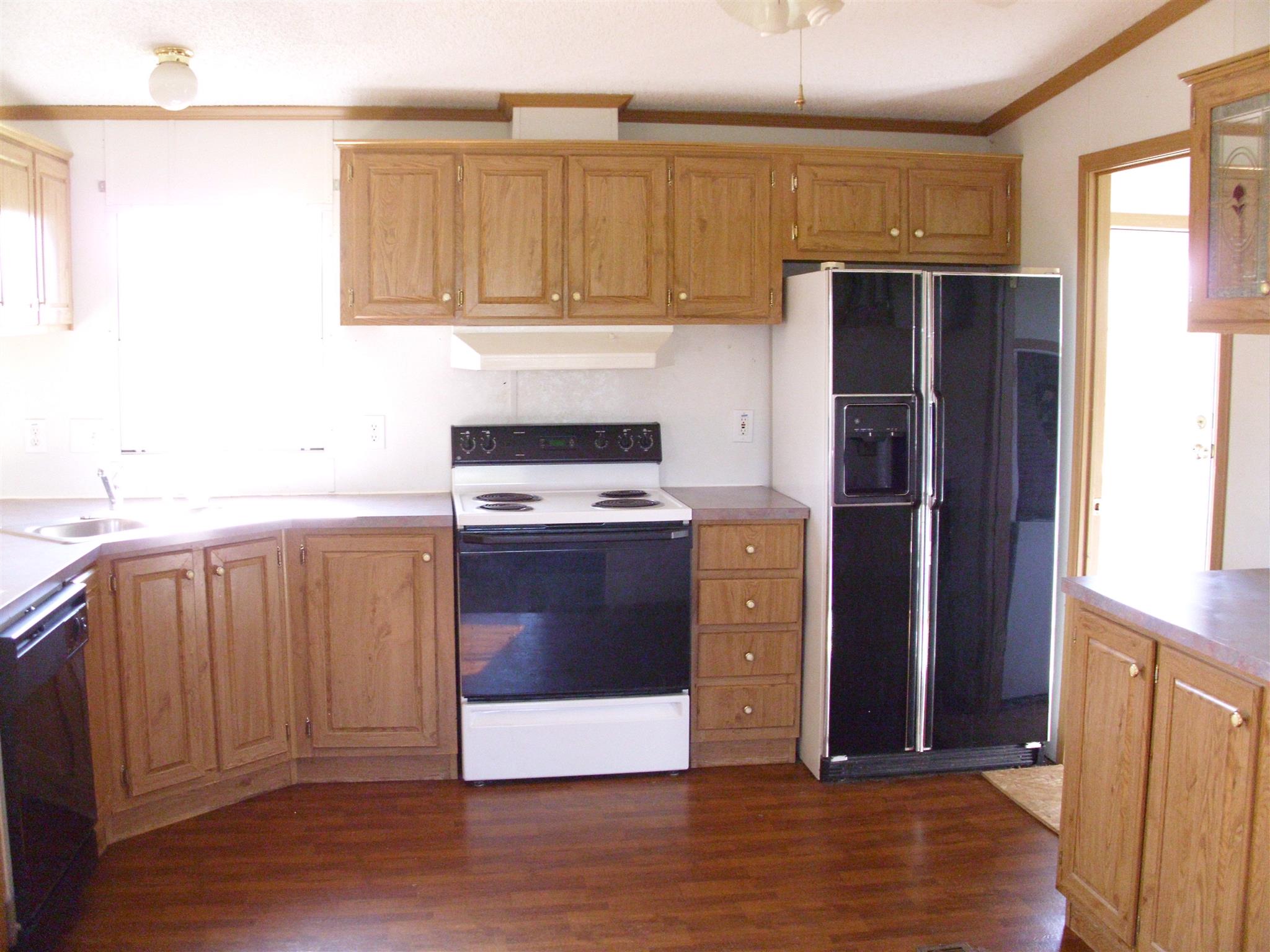 3763 Hoods Branch Road Springfield, TN 37172 - Photo 7 of 15 a kitchen with a refrigerator sink and cabinets