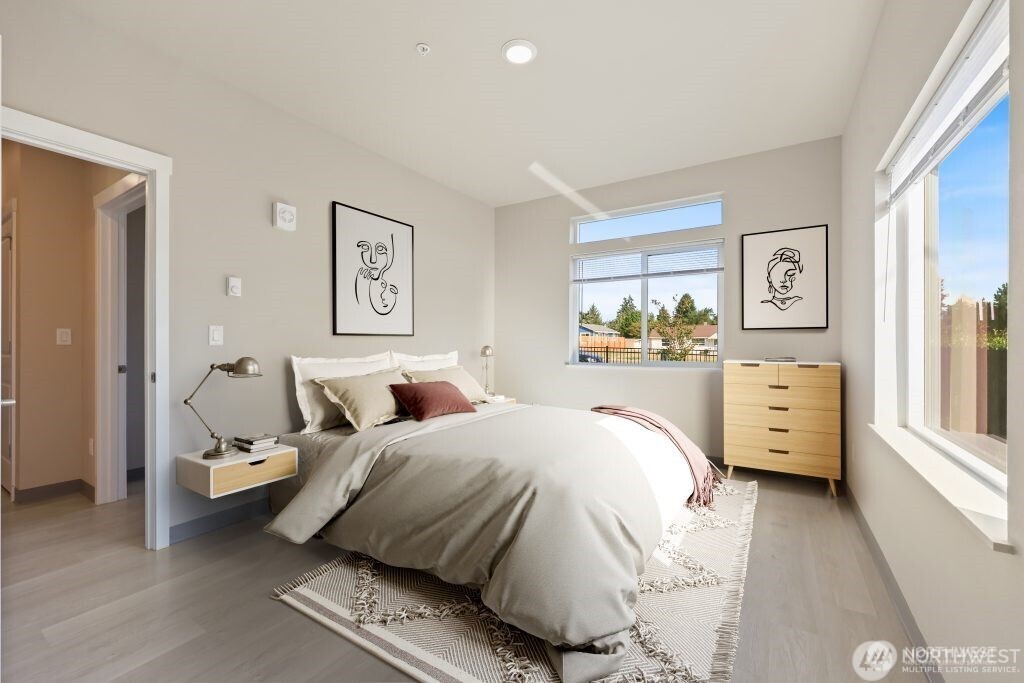 1202 East 72nd Street Tacoma, WA 98404 - Photo 16 of 25 a bedroom with a bed and a large window